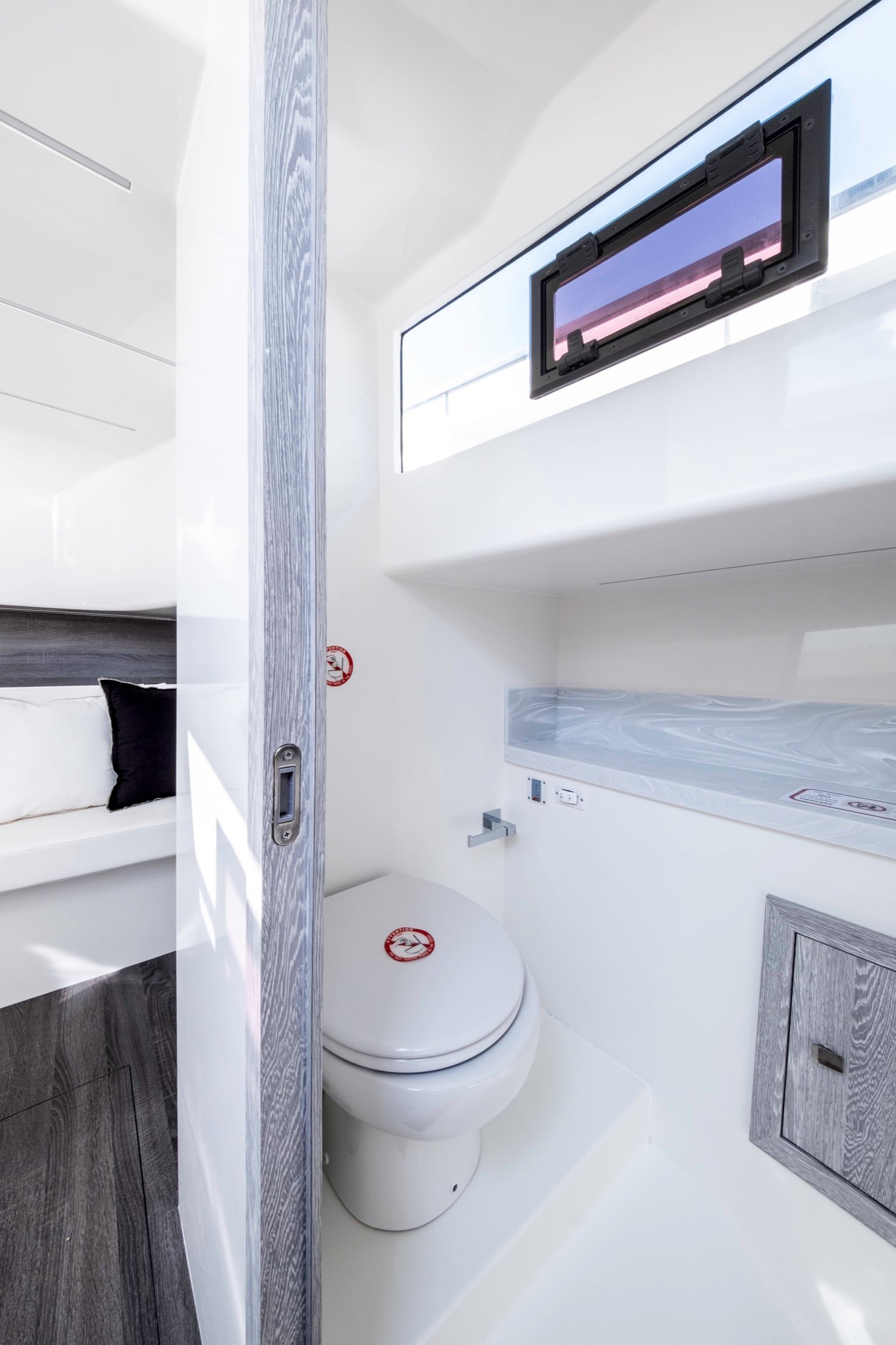 Kumbra 34 private bathroom with window, sink and storage
