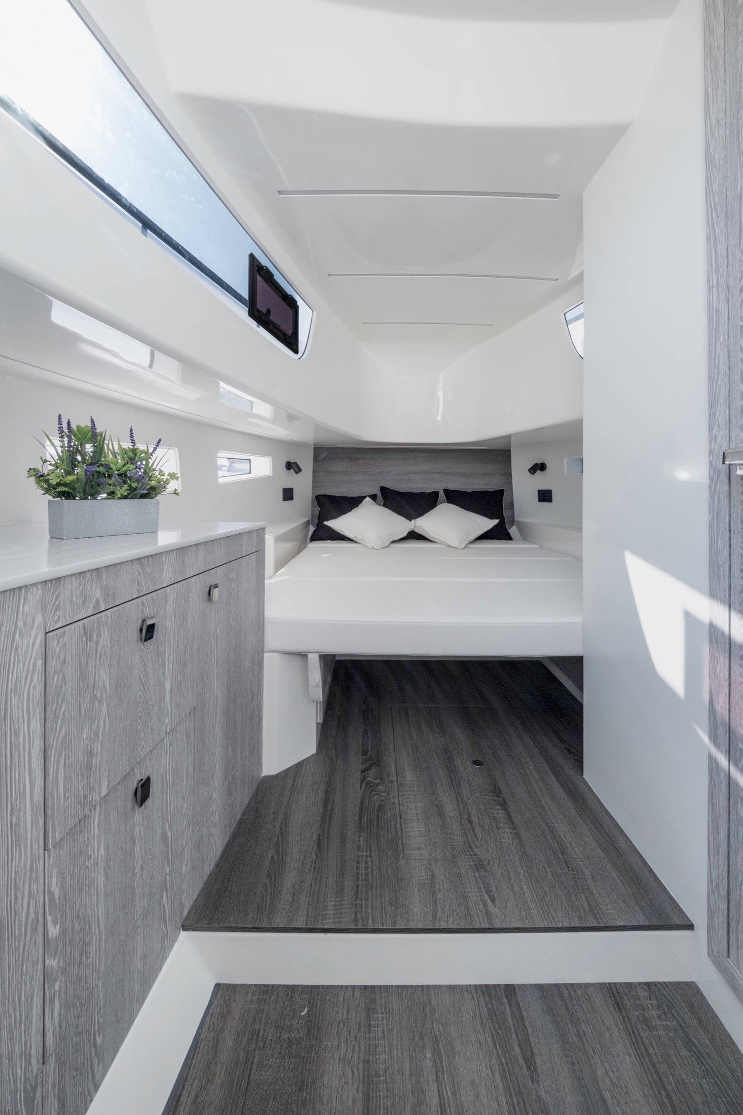 Kumbra 34 main cabin with double berth and light grey cabinetry