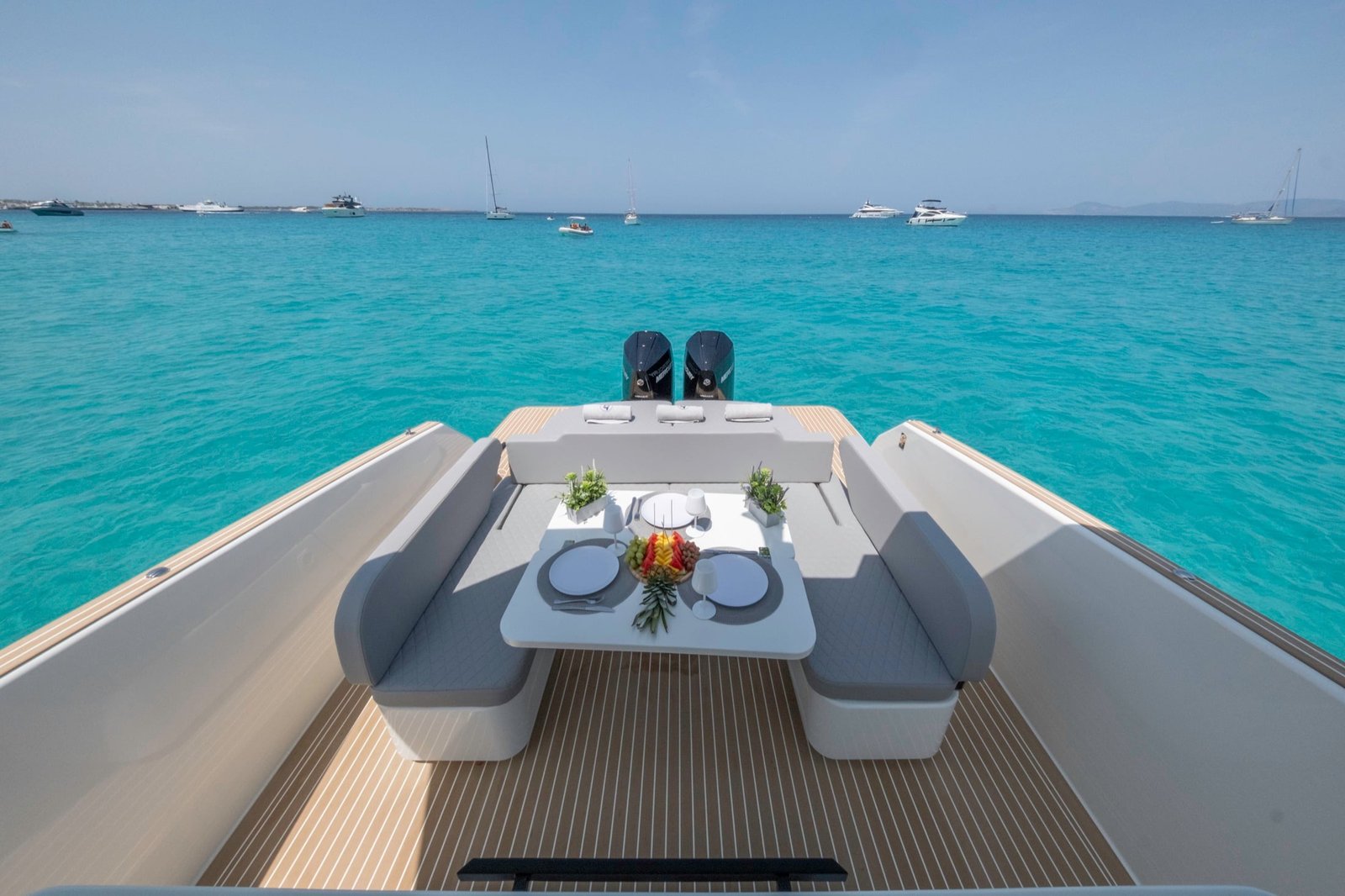 Kumbra 34 aft dining lounge overlooking turquoise water