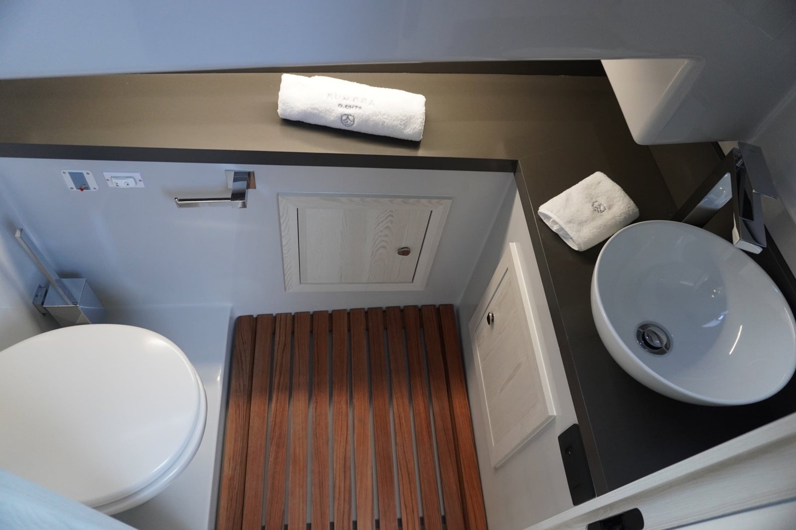 Kumbra 36 private bathroom with sink, toilet and teak floor