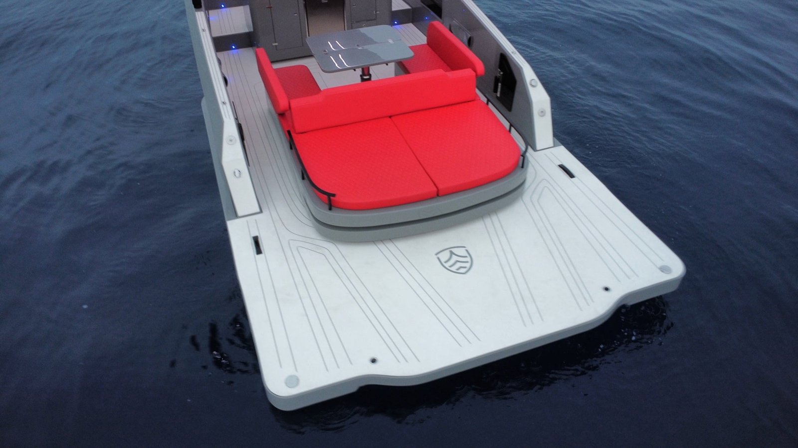 Large white swim platform and red aft sunbed on the Kumbra 36