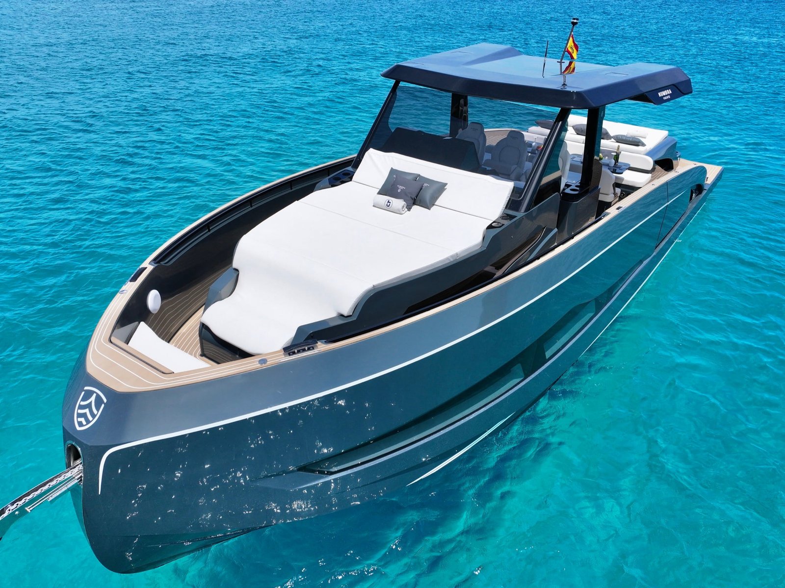 Aerial bow view of the Kumbra 43 and its large white sunbed