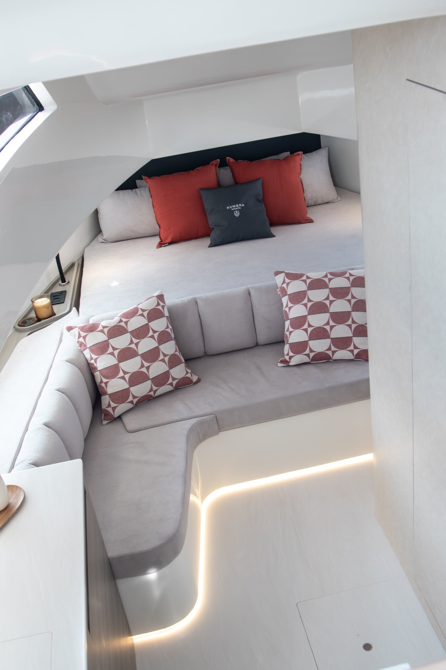 Kumbra 43 owner cabin with double berth and curved lounge seating
